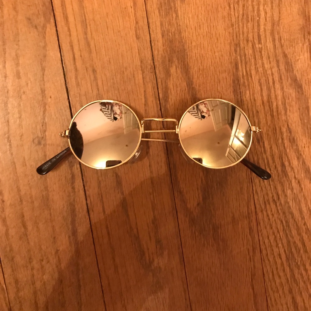 Gold rimmed round sunglasses